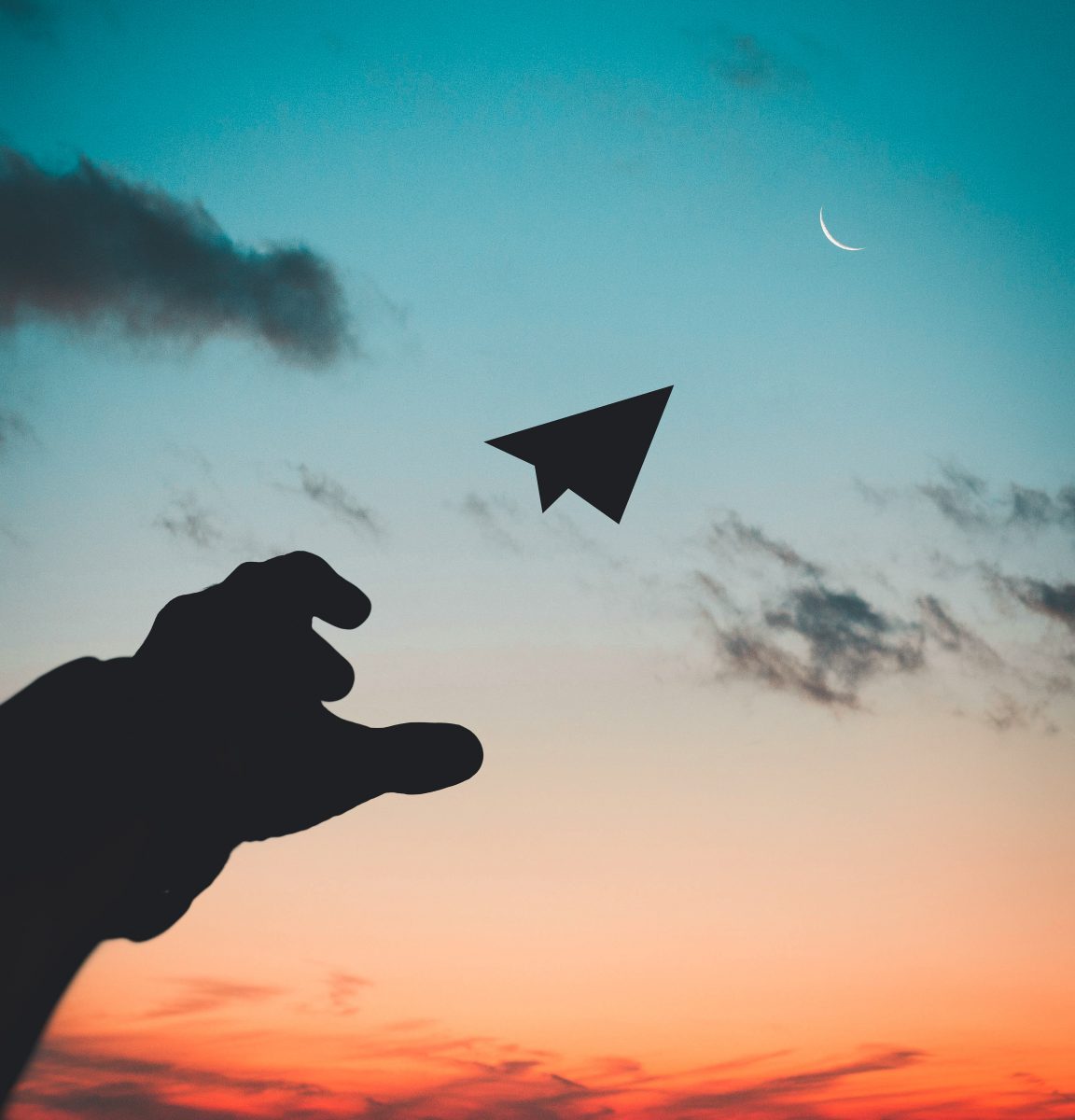 Person throwing paper airplane